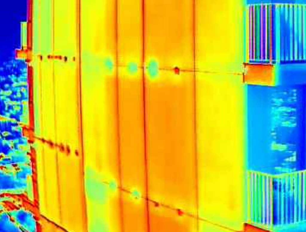 Multi-colored thermal IR images of a tower apartment building exterior.