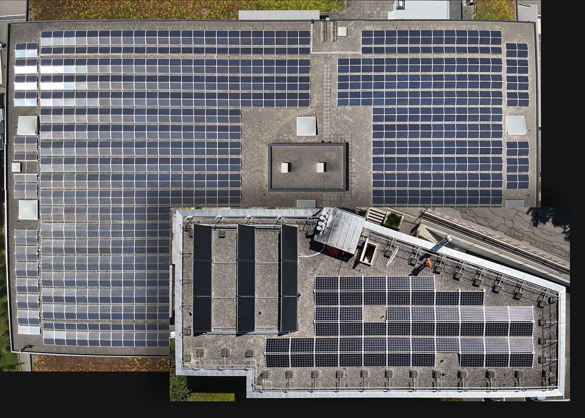 Overhead (nadir) view of two rooftop solar panel arrays.